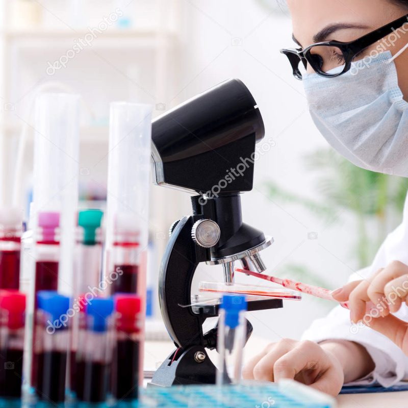 Young female chemist working in the lab