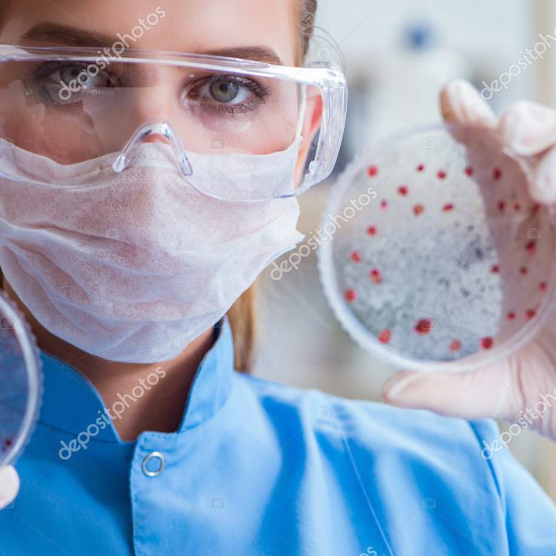 Female scientist researcher conducting an experiment in a laboratory