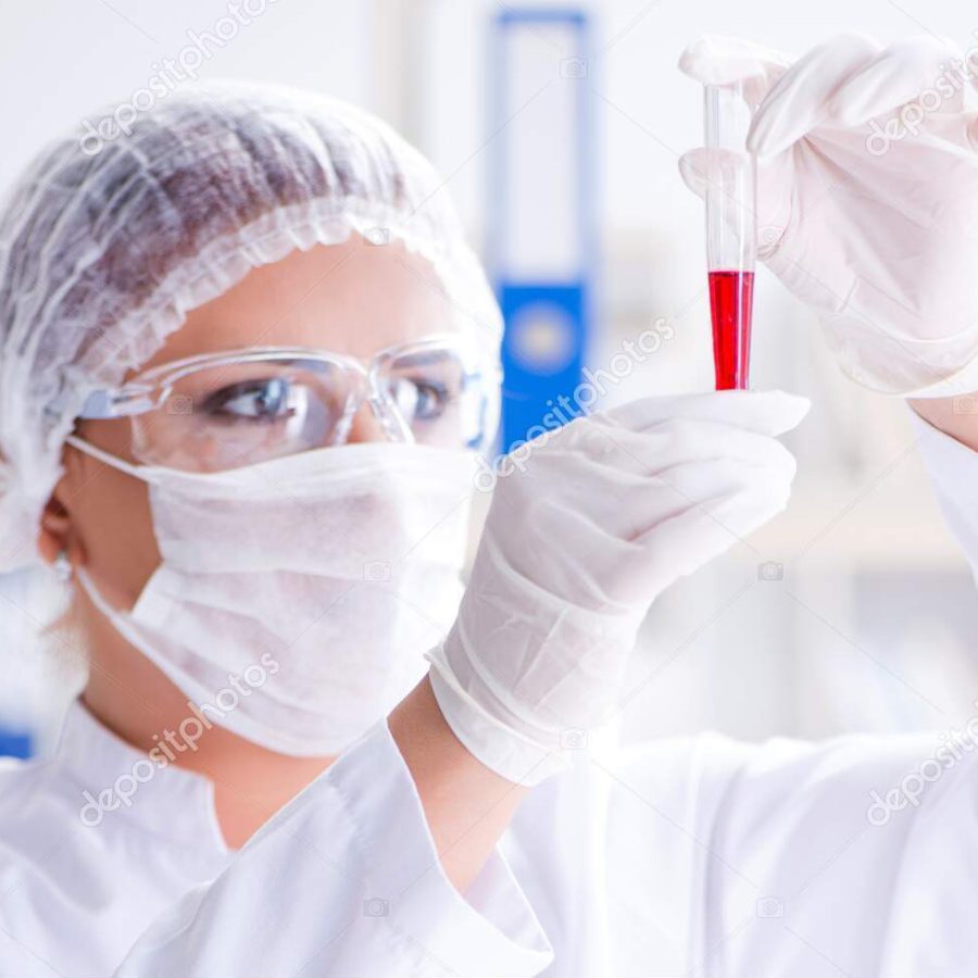Female scientist researcher conducting an experiment in a laboratory